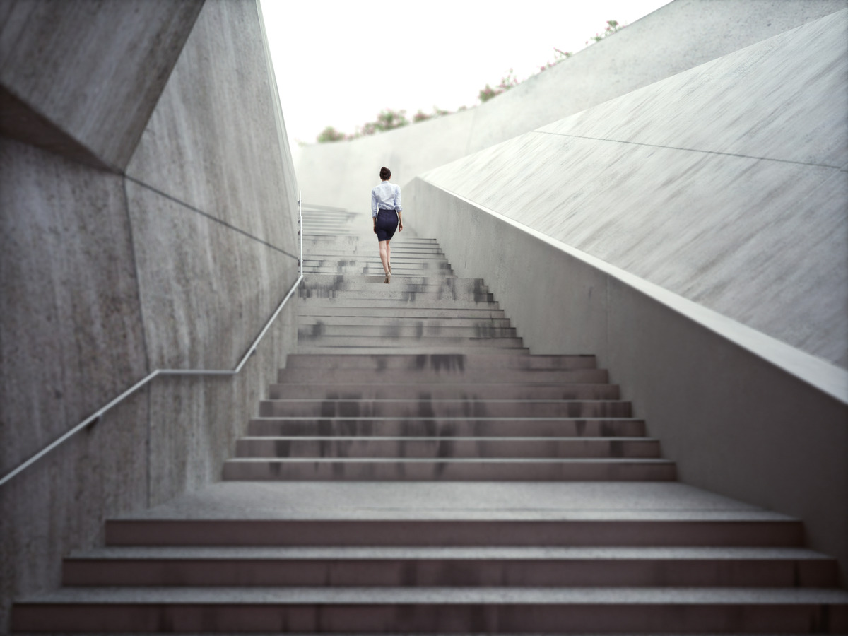 Image of person walking up stairs